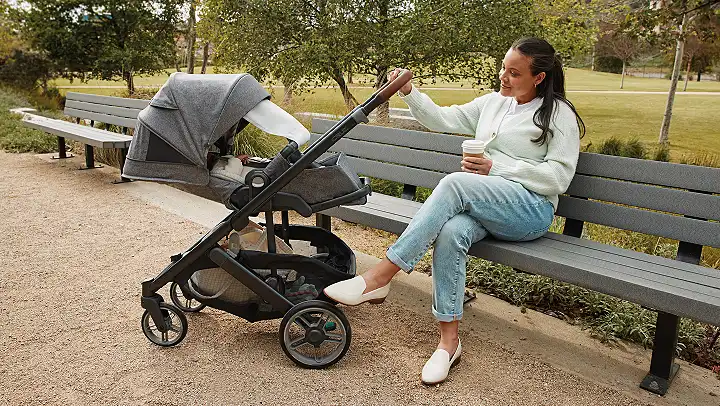 Mother with child, child is in cruz V3 with rain shield