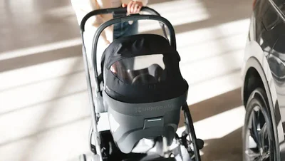 Mesa V3 car seat attaching to a stroller frame by a car