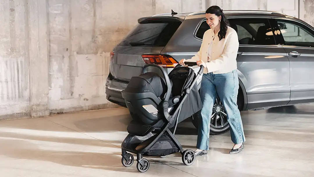 Parent pushing travel system