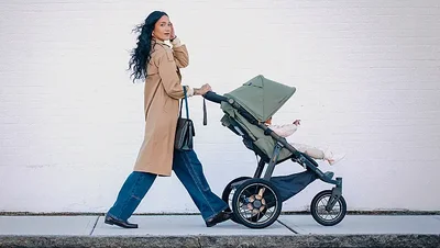 woman pushing stroller
